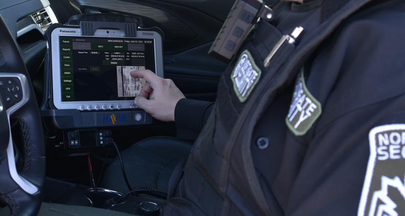 Security officer using mobile data terminal technology